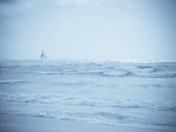 istock Blue toned yacht on horizon 926145344