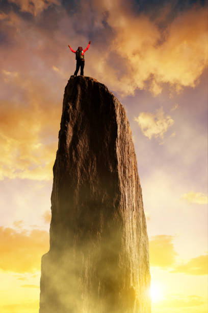 istock Climber on the top of the rock. 926147656
