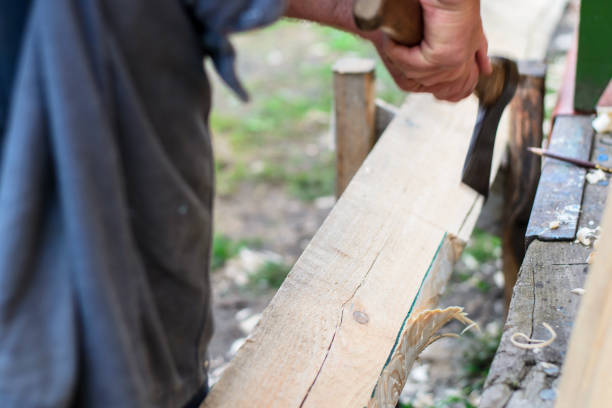 istock A man hacking a wooden board with an ax 926148268