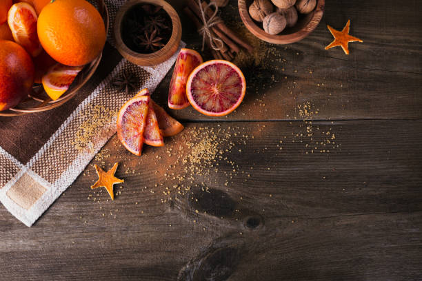 istock Fresh red orange fruit, anise, cinnamon and walnuts 926151376