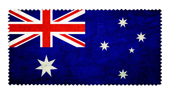Flag of Australia on grunge postage stamp background isolated