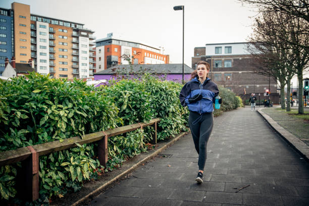 istock Female Running Through The City 926160102