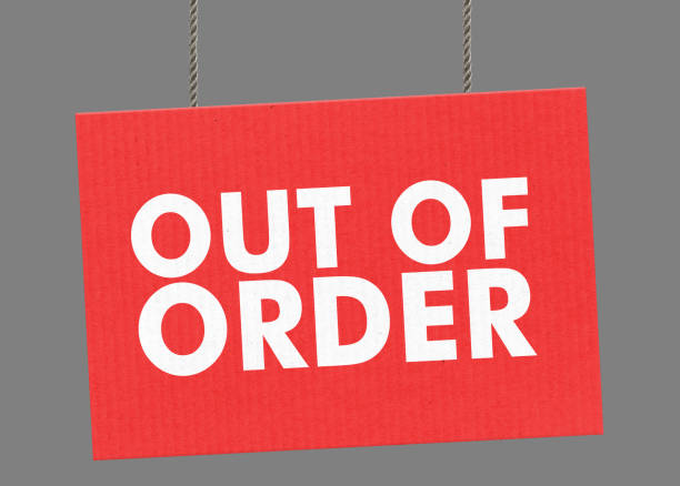 Out of order sign hanging from ropes. Clipping path included so you can put your own background. stock photo