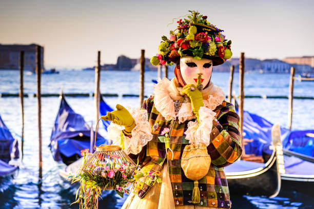 Venice, Italy, Feb 26 - A splendid mask appears in Piazza San Marco during the celebrations of the Venice Carnival. The magic of the Carnival is renewed in the city of the lagoon since 1296, when it was proclaimed a public holiday with an edict of the Venice Senate. Every year, during the Carnival period, hundreds of people show off marvelous and colorful costumes, evoking the glorious historical past of Venice with imaginary characters full of creativity and fantasy.