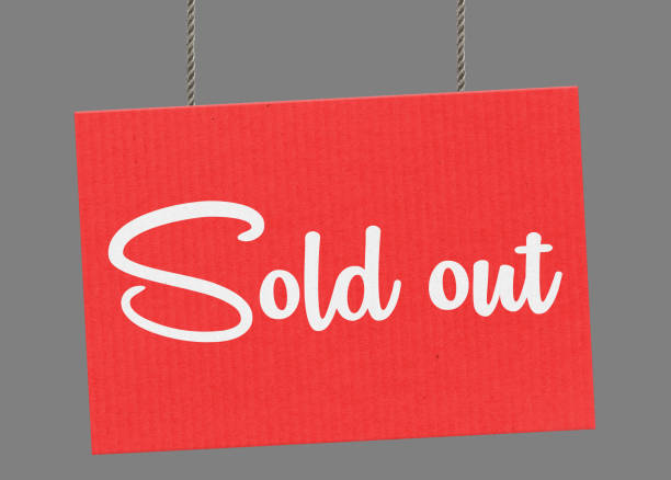 Sold out sign hanging from ropes. Clipping path included so you can put your own background. stock photo
