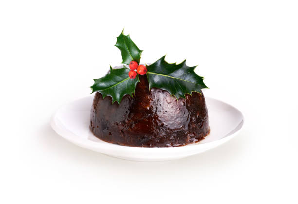 Christmas Pudding Christmas Pudding With a Sprig Of Holly Isolated On A White Background. christmas pudding stock pictures, royalty-free photos & images