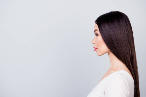 istock Close up side portrait of young confident manager standing over grey background with copy space 926178582