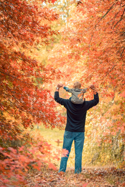 istock Father giving son piggyback ride 926179486