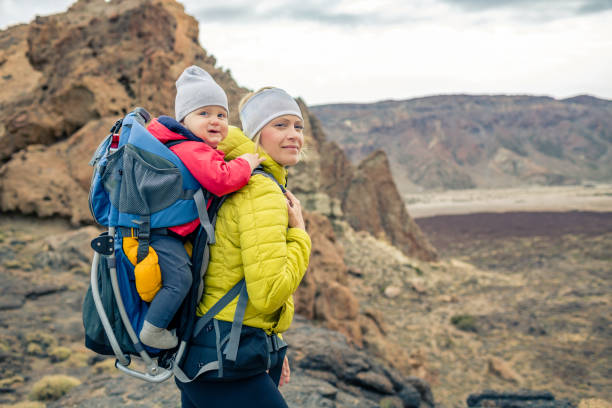 istock Family hike, mother with baby in backpack 926182008