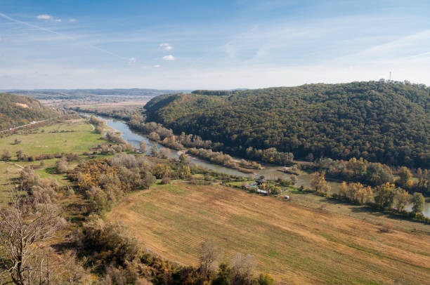 istock sunny day view of a river and forest 926182036