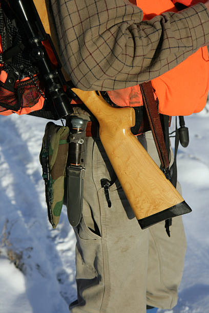 istock Hunter Close Up carrying rifle and knife 92618256