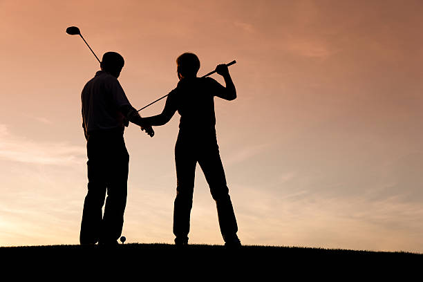 istock Mature couple playing Golf at sunset 92618332