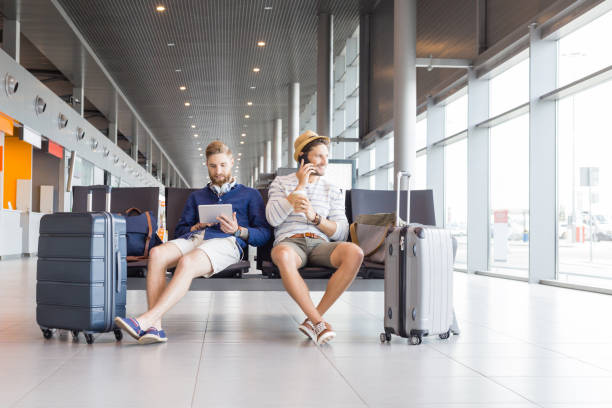 istock Friends waiting for flight in airport lounge 926189800