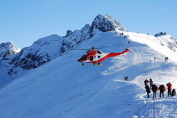 istock Red rescue helicopter rescuing people stuck in snow 92619374