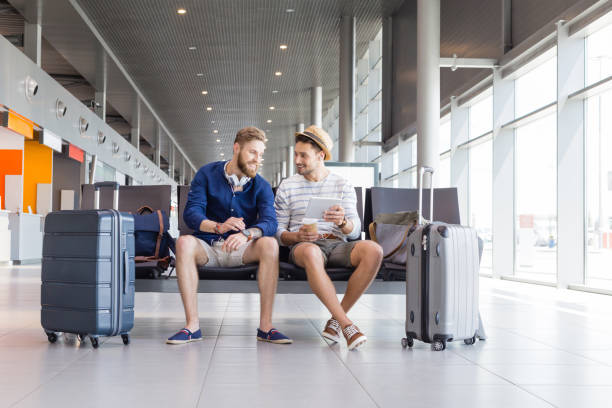 istock Friends waiting for flight in airport lounge 926193840
