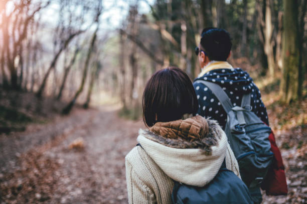 istock Couple walking on forest trail 926193912