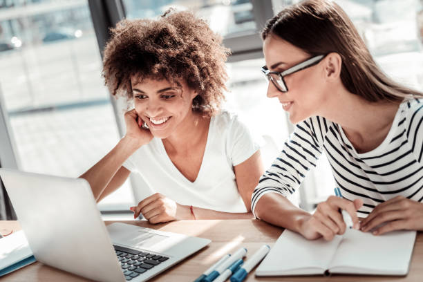 istock Joyful positive women looking at the laptop screen 926203788