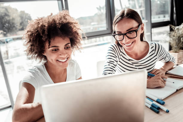 istock Happy delighted women working together 926203842