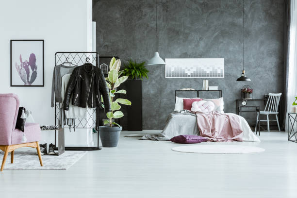 istock Clothes in multifunctional bedroom interior 926203854