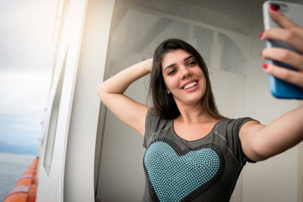 istock Woman Taking a Selfie from a cruise ship 926207714