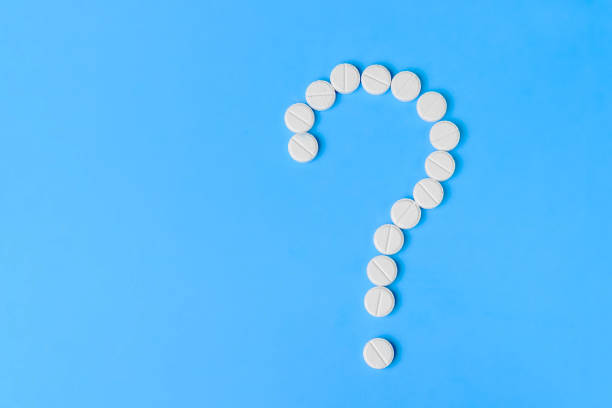 istock Question from medicines on a blue background, medical pills 926208748
