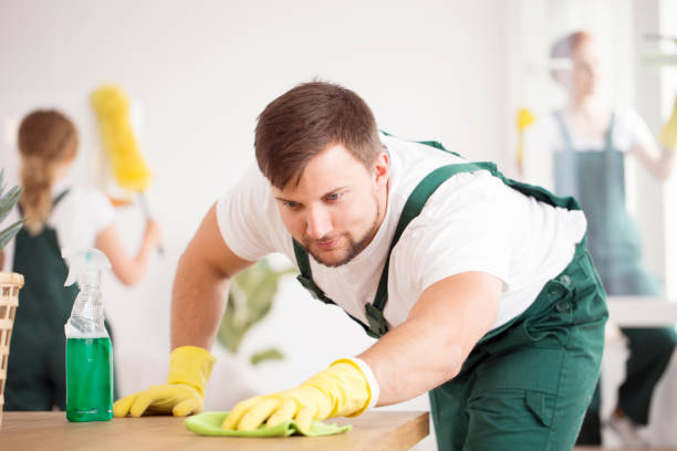 istock Cleaning expert washing the table 926208774