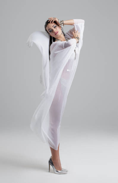 istock Oriental belly dancer in high heels performance on gray background 926211766