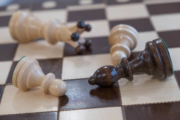 istock chess board and pieces scattered on the board on a white background 926213040