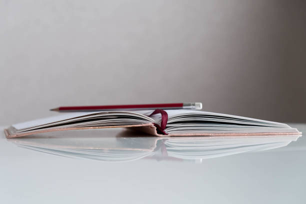 istock Education and wisdom concept - open book and copy space. Back to school. reading concept. opened empty notebook. exam preparation, writing utensils. pencil. 926215318