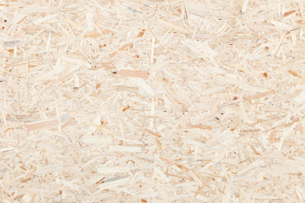 limpie la superficie de la partícula de madera junta. textura del tablero de virutas de madera comprimida. - chipboard fotografías e imágenes de stock