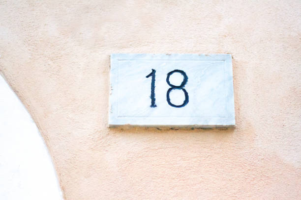 istock Italy: Antique Ceramic Number 18 Street Address Tile; Old Wall 926219540