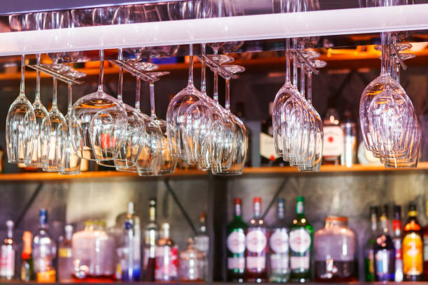 different glasses hanging over the bar. Soft focus. selective focus