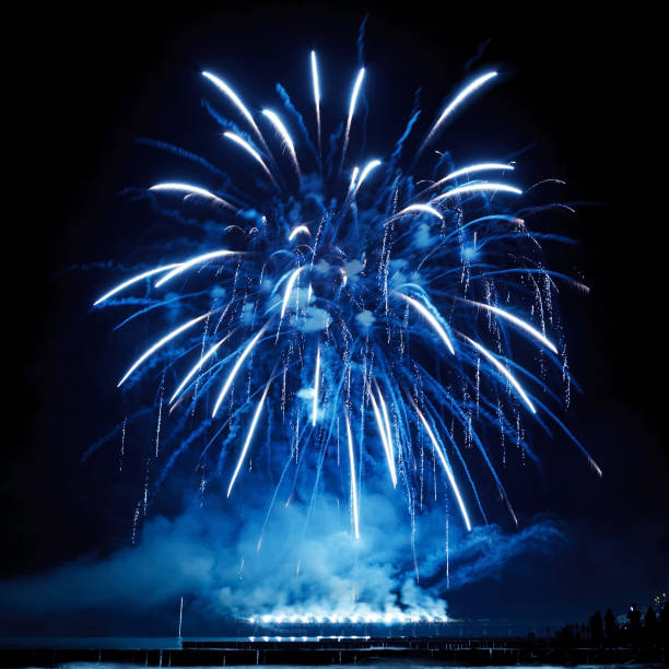 istock Beautiful blue fireworks on the black sky background. 926235236
