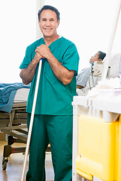 Orderly Mopping Floor In Hospital  mop photos stock pictures, royalty-free photos & images