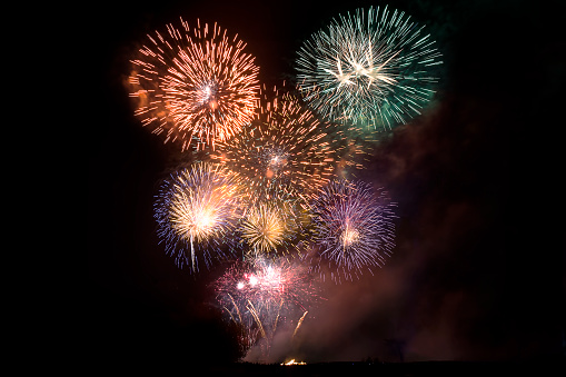A large display of fireworks brightly coloured
