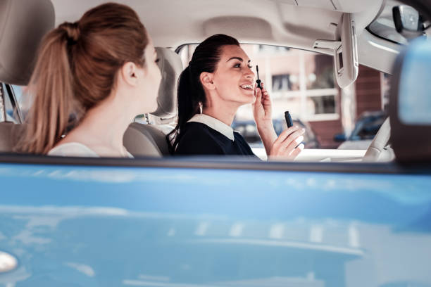 istock Pretty joyful woman looking in the mirror and sprucing. 926239382