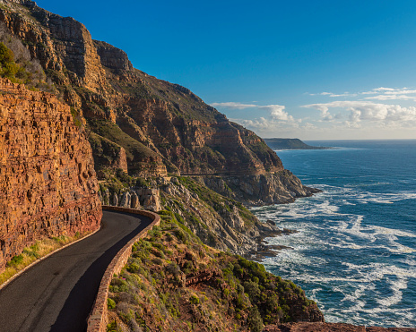 Driving from Hout Bay, near Cape Town, along the twisty Chapmans Peak Road, the scenery is spectacular, as the road is cut into the rocks with the ocean just below.