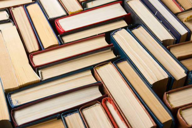 istock Stack of books background. many books piles. 926242786
