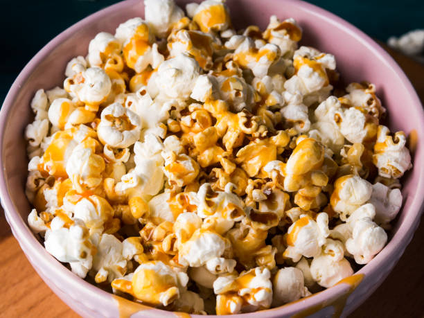 istock Popcorn with caramel in bowl on dark background 926247236
