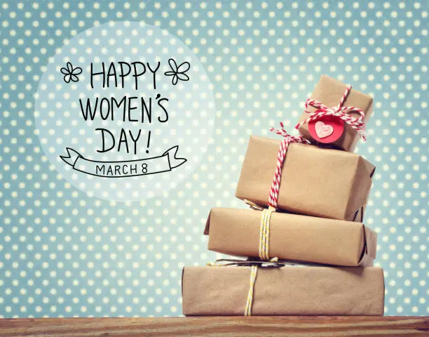 Women's Day message with stack of gift boxes