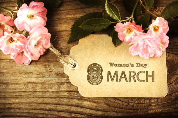 istock March 8th Womens Day message tag with flowers in vintage style 926250192