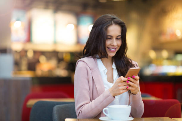 istock Young woman drinking coffee in cafe 926250532