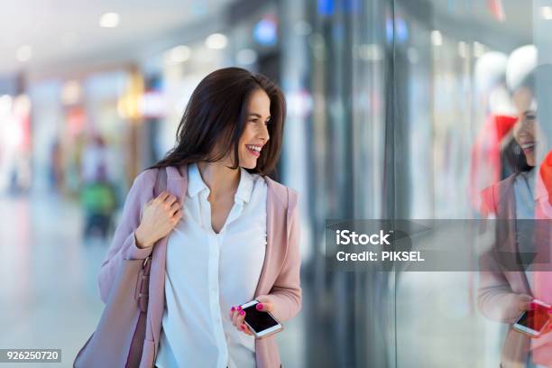 Woman Shopping For Clothes Stock Photo - Download Image Now - Window Shopping, One Woman Only, Women