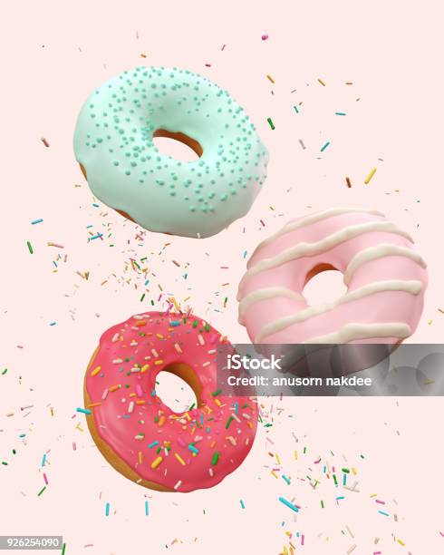 Flying Pink And Blue Doughnuts Stock Photo - Download Image Now - Doughnut, Candy, Falling