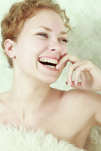 Close-up portrait of sexy caucasian young smiling woman stock photo