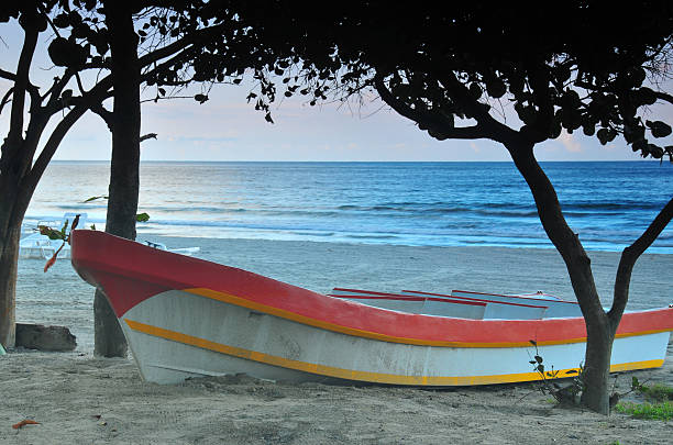 A local fishing boat on the beach in La Ceibia Honduras, Central America.