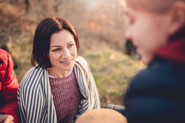 istock Mother talking with daughter outdoors 926259788