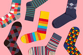 Multi colored socks on pink background