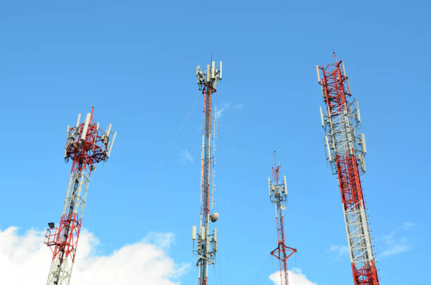 istock Group of telecommunication towers against blue sky background 926261352