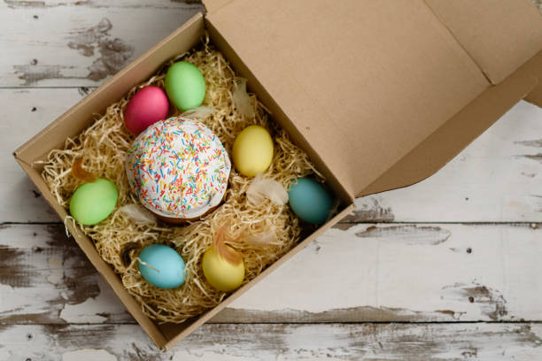 istock Easter cake and colorful painted eggs in a box 926267760